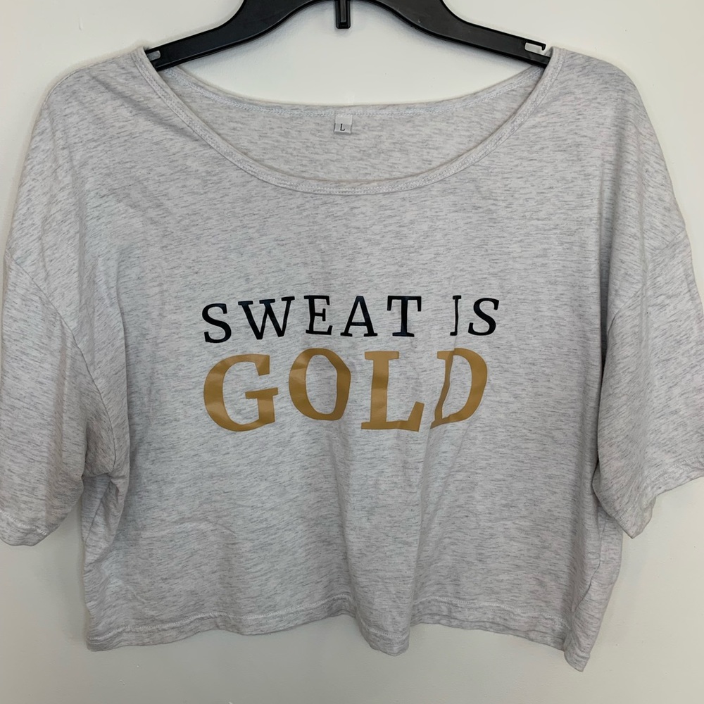 Sweat is gold cropped shirt.